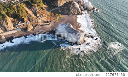 Large rocks natural monument Piedra de Iglecias Church stone on Chilean coast in Constitucion in sunset. 117673430