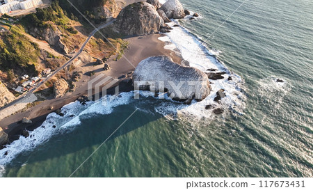 Large rocks natural monument Piedra de Iglecias Church stone on Chilean coast in Constitucion in sunset. Large rocks natural monument Piedra de Iglecias Church stone on Chilean coast in Constitucion in sunset. 117673431