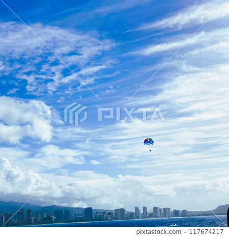 Flying freely in the sky, feeling the wind on a parachute and feeling an infinite sense of adventure 117674217