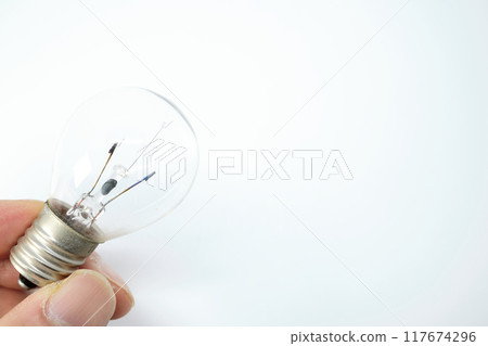 Light bulb in hand 117674296
