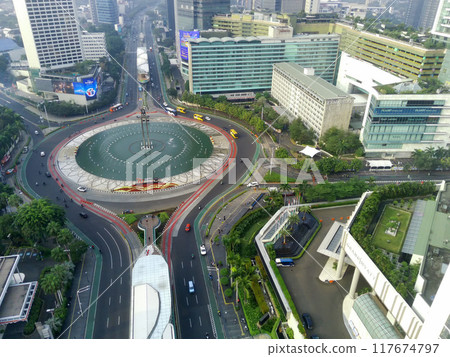 Aerial view of Bundaran HI, a bustling roundabout in Jakarta, Indonesia. Aerial view of Bundaran HI, a bustling roundabout in Jakarta, Indonesia. 117674797