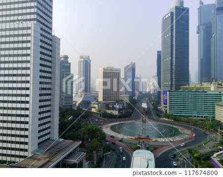 Aerial view of Bundaran HI, a bustling roundabout in Jakarta, Indonesia. 117674800
