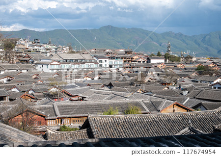 Rooftop view of Lijiang old town. It is a well-preserved Naxi ancient town, listed as UNESCO World Heritage site in 1997. Rooftop view of Lijiang old town. It is a well-preserved Naxi ancient town, listed as UNESCO World Heritage site in 1997. 117674954