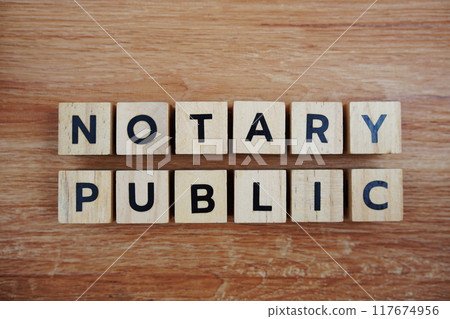 Notary Public alphabet letters top view on wooden background, business and law concept Notary Public alphabet letters top view on wooden background, business and law concept 117674956