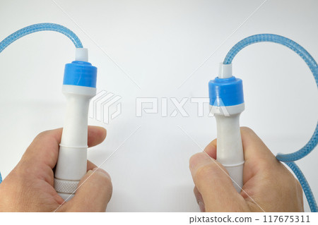 Image of a person exercising with a jump rope 117675311