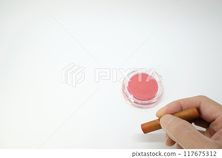 Image of a person holding a stamp Image of a person holding a stamp 117675312