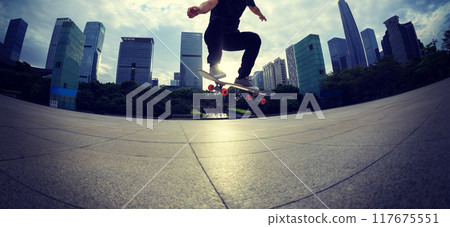 Skateboarder skateboarding outdoors in city Skateboarder skateboarding outdoors in city 117675551