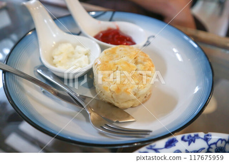 scone or scone with whipped cream and strawberry jam scone or scone with whipped cream and strawberry jam 117675959