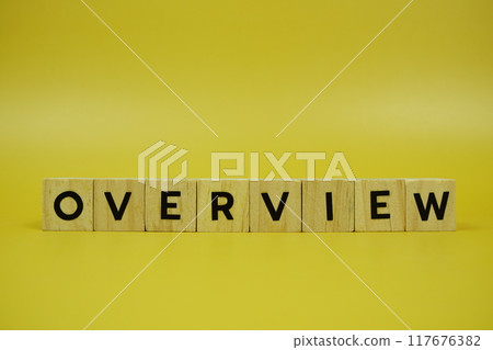 Overview with wooden blocks alphabet letters on yellow background Overview with wooden blocks alphabet letters on yellow background 117676382