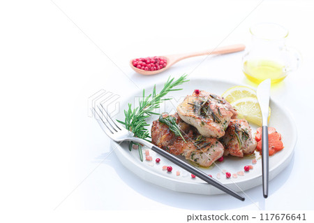 Grilled chicken thighs with herbs (rosemary, sage, basil) 117676641