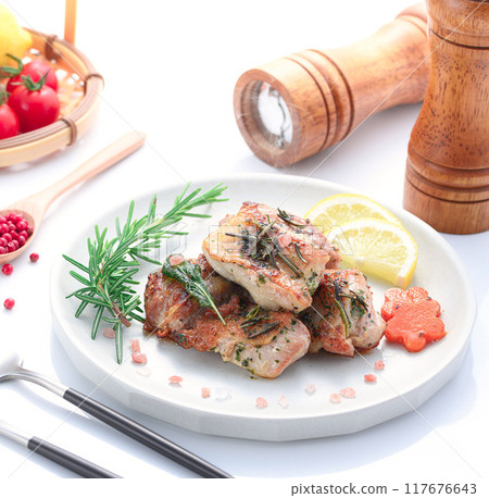 Grilled chicken thighs with herbs (rosemary, sage, basil) 117676643