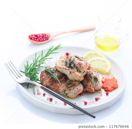 Grilled chicken thighs with herbs (rosemary, sage, basil) 117676646