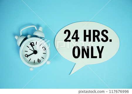 24 Hrs only text on speech bluble with alarm clock top view on blue background 117676996