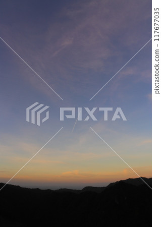 Sunset sky, clouds, contrails, mountains Sunset sky, clouds, contrails, mountains 117677035