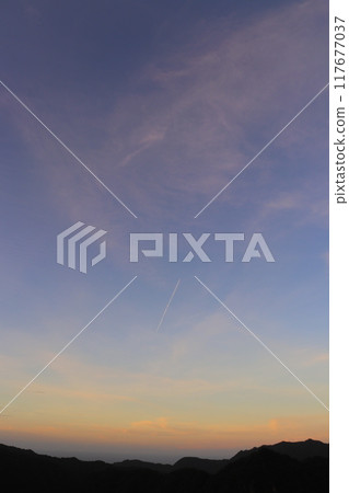 Sunset sky, clouds, contrails, mountains Sunset sky, clouds, contrails, mountains 117677037