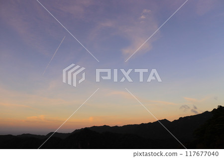 Sunset sky, clouds, contrails, mountains Sunset sky, clouds, contrails, mountains 117677040