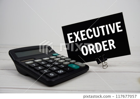 Excutive Order text message with calculate on wooden background Excutive Order text message with calculate on wooden background 117677057