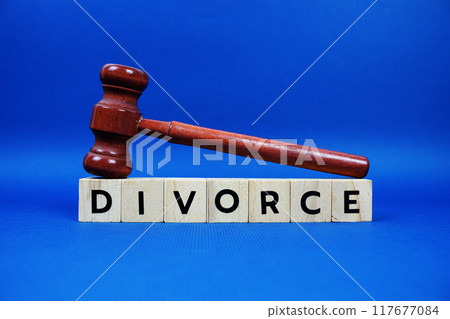 Divorce alphabet letters with wooden blocks alphabet letters and Gavel on blue background Divorce alphabet letters with wooden blocks alphabet letters and Gavel on blue background 117677084