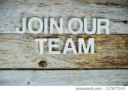 Join our team alphabet letters on wooden background 117677243