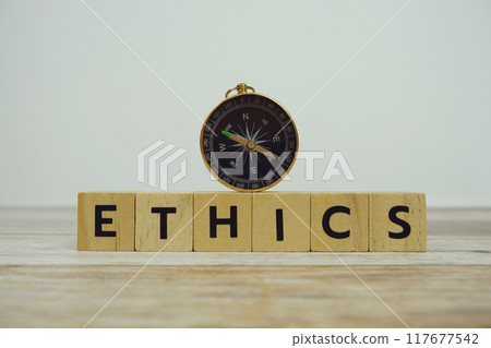 Compass with wooden blocks alphabet letters ETHICS on wooden background 117677542