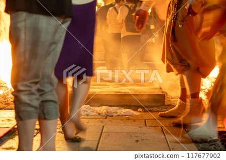 A monk guiding a fire walker at the Toka Kannon temple in Tsu City, Mie Prefecture 117677902