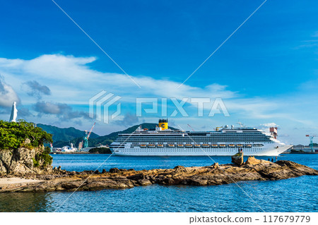 Cruise ship departs from Nagasaki Port: Costa Serena from the Island of the Gods and the Statue of Mary on the Cape [Nagasaki City] 117679779