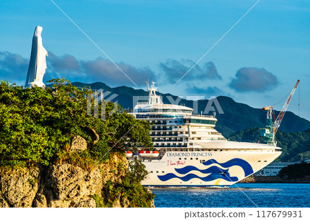 Cruise ship departs from Nagasaki Port: Diamond Princess and the Statue of Mary on the Cape from the Island of the Gods [Nagasaki City] 117679931
