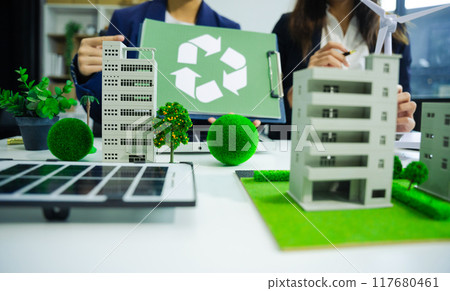 Engineer Teamwork Meeting, with partner on model building at company office working technology, Renewable energy-based green businesses and global warming. 117680461