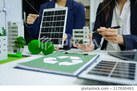 Engineer Teamwork Meeting, with partner on model building at company office working technology, Renewable energy-based green businesses and global warming. 117680463