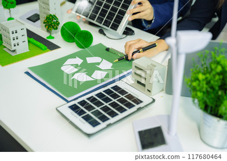 Engineer Teamwork Meeting, with partner on model building at company office working technology, Renewable energy-based green businesses and global warming. 117680464