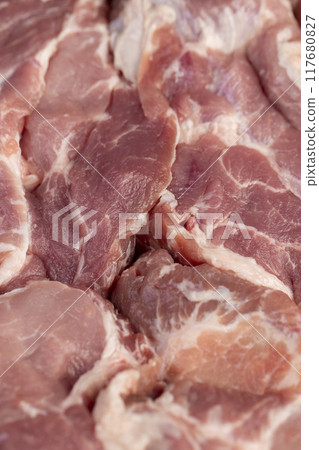 a sliced piece of pork meat from the neck 117680827