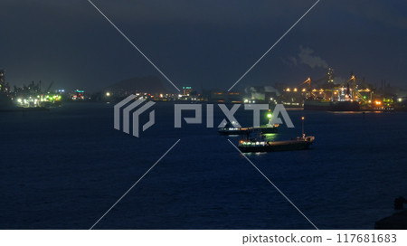 Factory night view across the sea 117681683