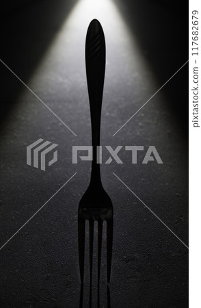 Standing fork in back light Standing fork in back light 117682679