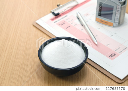 Salt on a plate High blood pressure image 117683578