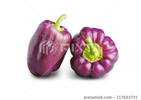 Two fresh raw paprika, purple sweet bell peppers isolated on white background, food ingredient 117683735