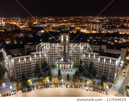 Aerial night city, illuminated University building 117684629