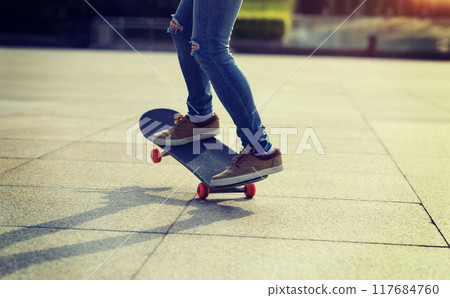 Skateboarder riding skateboard in city Skateboarder riding skateboard in city 117684760