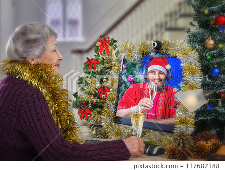 Digital Yuletide Joy: Elderly Woman's Virtual Toast with Santa Demonstrates How Technology Combats Isolation During Holidays. Digital Yuletide Joy: Elderly Woman's Virtual Toast with Santa Demonstrates How Technology Combats Isolation During Holidays. 117687188
