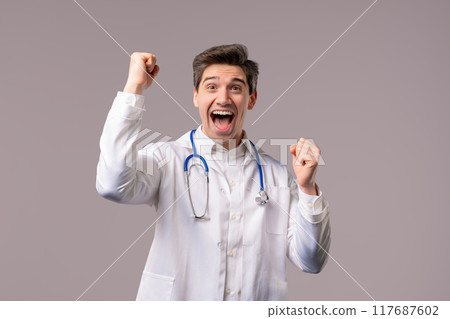 Mature doctor man, triumph yes gesture of victory. Surprised excited physician 117687602
