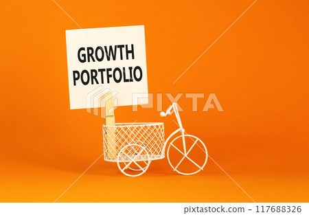 Growth portfolio symbol. Concept words Growth portfolio on beautiful white paper on wooden clothespin. Beautiful orange background. Bike model. Business Growth portfolio concept. Copy space. 117688326