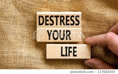Destress your life symbol. Concept words Destress your life on wooden blocks. Doctor hand. Beautiful canvas table canvas background. Psychological business and destress your life concept. Copy space. 117688365