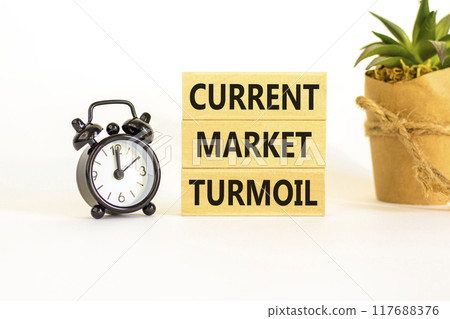 Current market turmoil symbol. Concept words Current market turmoil on wooden blocks on a beautiful white table white background. Black alarm clock. Business, finacial current market turmoil concept. Current market turmoil symbol. Concept words Current market turmoil on wooden blocks on a beautiful white table white background. Black alarm clock. Business, finacial current market turmoil concept. 117688376