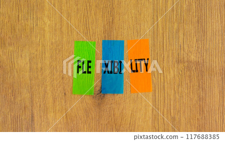 Flexibility symbol. Concept word Flexibility on beautiful colored paper. Beautiful wooden background. Business flexibility concept. Copy space. Flexibility symbol. Concept word Flexibility on beautiful colored paper. Beautiful wooden background. Business flexibility concept. Copy space. 117688385