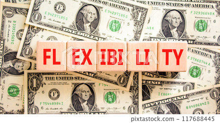 Flexibility symbol. Concept word Flexibility on beautiful wooden blocks. Dollar bills. Beautiful background from dollar bills. Business flexibility concept. Copy space. 117688445