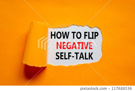 Flip negative self-talk symbol. Concept words How to flip negative self-talk on white paper on a beautiful orange background. Psychological and flip negative self-talk concept. Copy space. Flip negative self-talk symbol. Concept words How to flip negative self-talk on white paper on a beautiful orange background. Psychological and flip negative self-talk concept. Copy space. 117688536