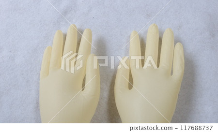 Yellow rubber gloves placed on the hands, women's size S, both hands 117688737