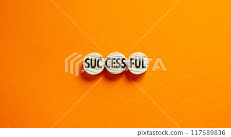 Successful symbol. Concept word Successful on beautiful wooden circles. Beautiful orange background. Business successful concept. Copy space. Successful symbol. Concept word Successful on beautiful wooden circles. Beautiful orange background. Business successful concept. Copy space. 117689836