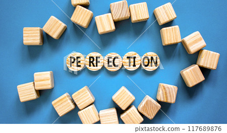 Perfection symbol. Concept word Perfection on beautiful wooden circles. Beautiful blue background. Beautiful wooden cubes. Business perfection concept. Copy space. 117689876
