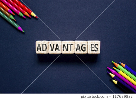 Advantages symbol. Concept word Advantages on beautiful wooden cubes. Beautiful black background. Beautiful colored pencils. Business advantages concept. Copy space. 117689882