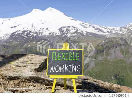 Flexible working symbol. Concept words Flexible working on beautiful yellow blackboard. Beautiful mountain Elbrus background. Business flexible working concept. Copy space. 117689914